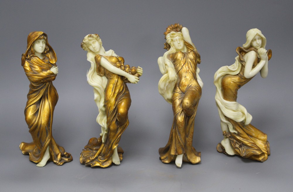 A set of four Italian gilt resin figures of maidens representing The Seasons, stamped STT, height 20cm